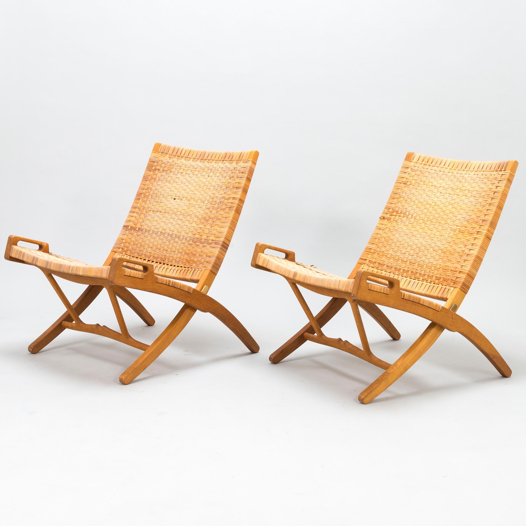 HANS J WEGNER, A pair of JH-512 folding chairs for Johannes Hansen, Denmark, early 1980s. Model designed in 1949.