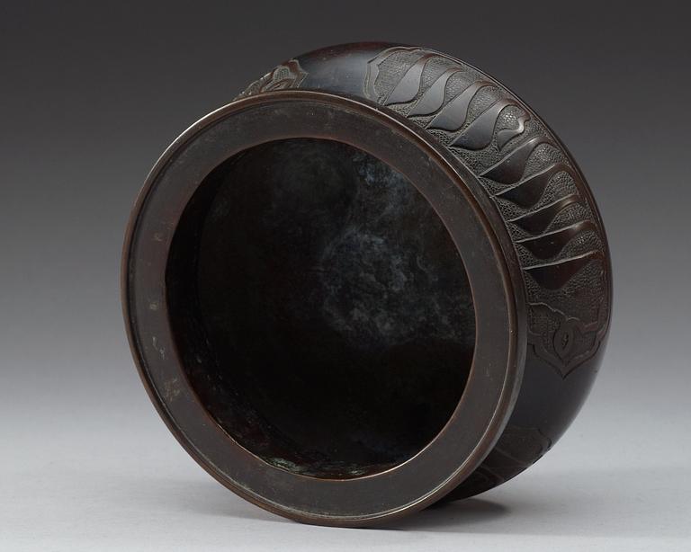 A bronze tripod censer, Qing dynasty.