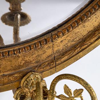 A Gustavian two-light girandole mirror, Stockholm, late 18th century.