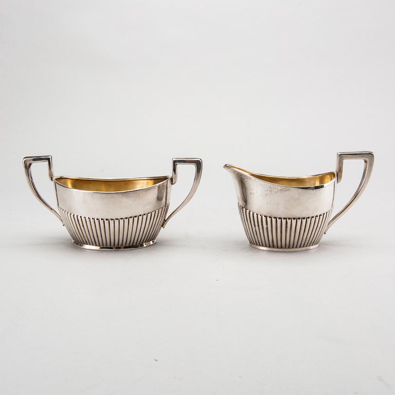 A three piece silver coffee service mark of CG Hallberg Stockholm 1916, weight 896 gram.