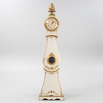 A long-case clock, 19th century.
