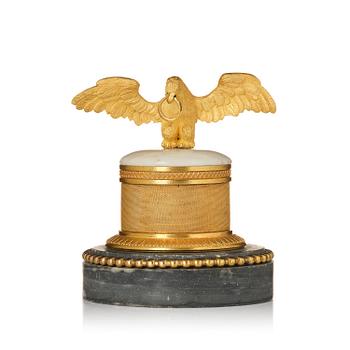 330. A French Empire ormolu and marble paperweight, early 19th century.