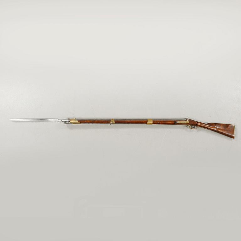 A percussion rifle with bayonet, probably swedish model 1815-45.