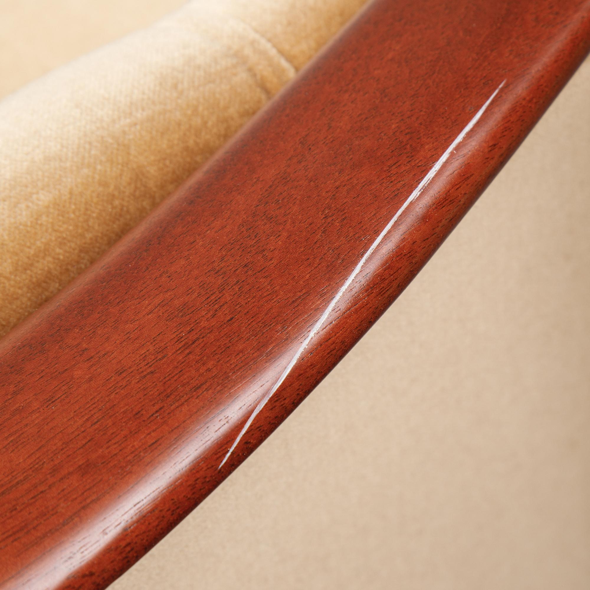 A pair of mahogany and velvet easy chairs by Bröderna Andersson, 1960's.