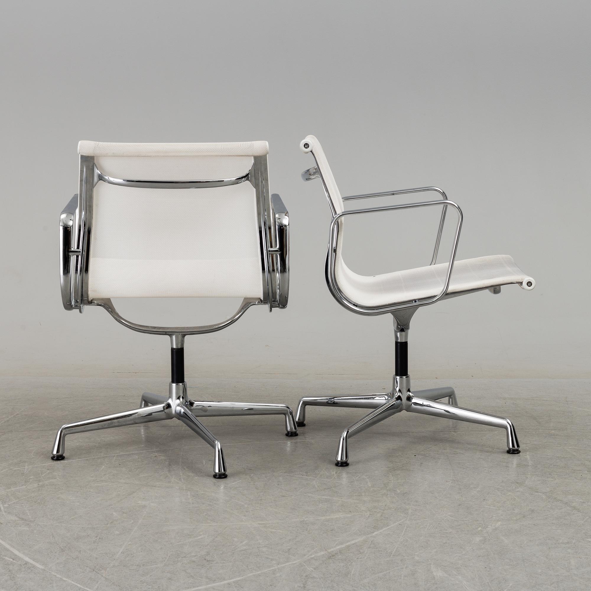 A pair of 'EA 108' desk chairs by Charles & Ray Eames for Vitra.