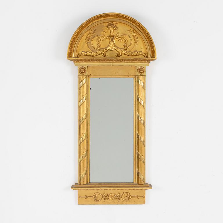 A giltwood Empire mirror by J. P. Holmberg (active in Stockholm 1813 - 1831).