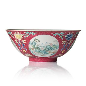 833. A famille rose ruby ground sgrafitto 'landscape' bowl, Qing dynasty, seal mark and period of Daoguang (1820-50).