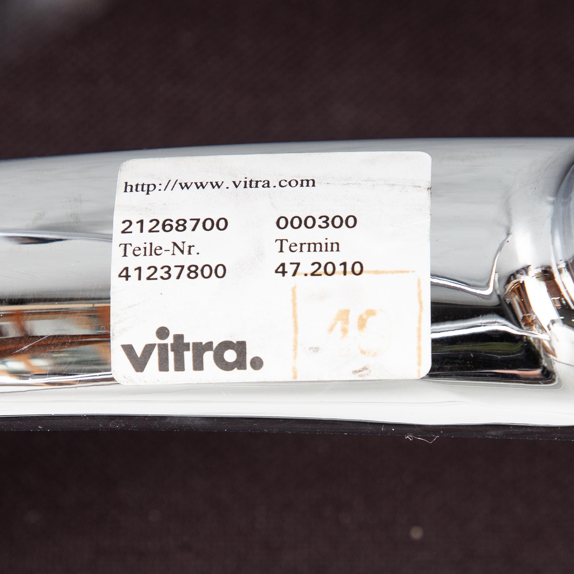 An EA 208 Soft Pad swivel chair by Charles and Ray Eames for Vitra, dated 2010.