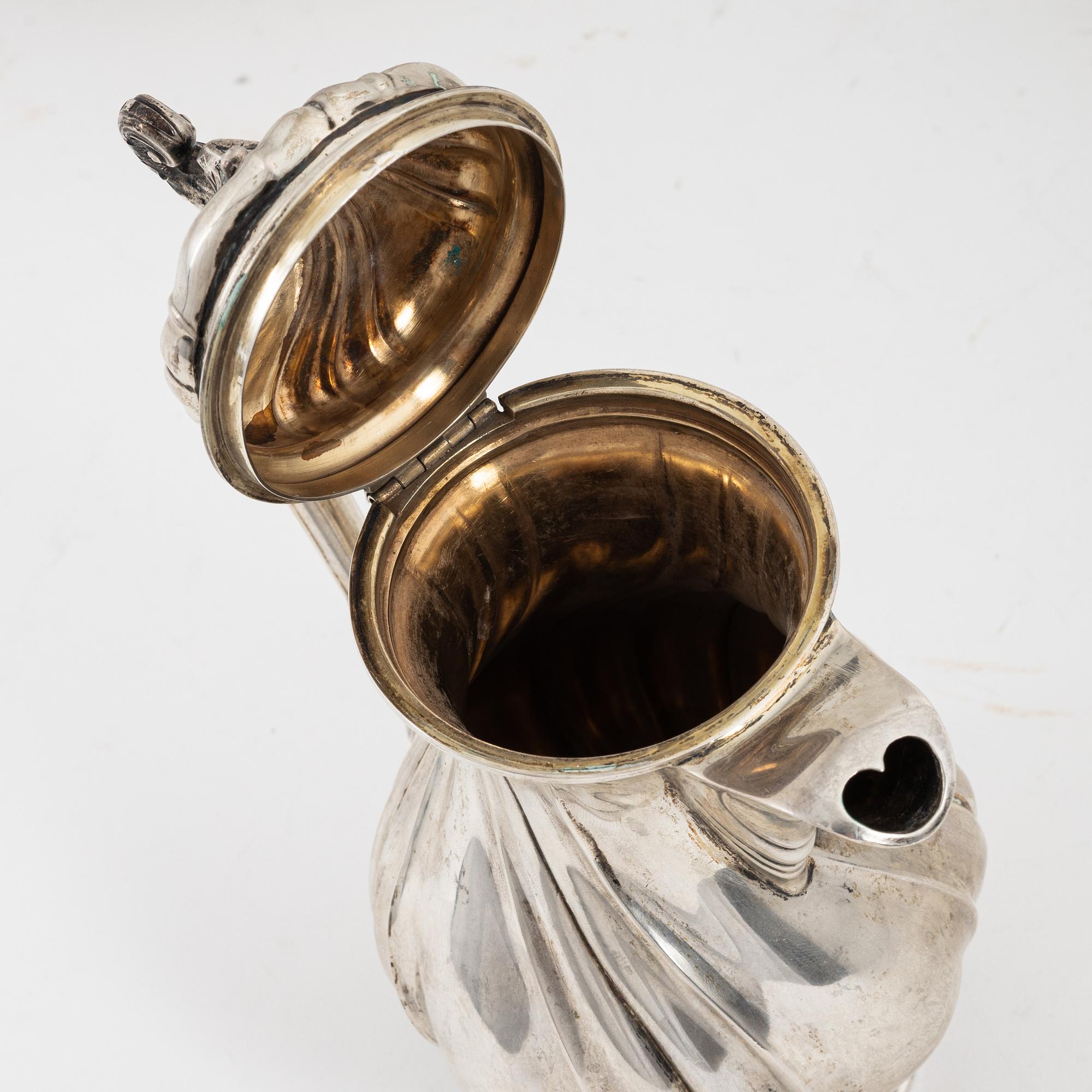 A Rococo style silver sugarbox and two creamers, including Lars Larsson ...