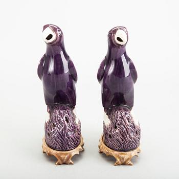 A pair of Chinese late Qing porcelain parrot figurines.