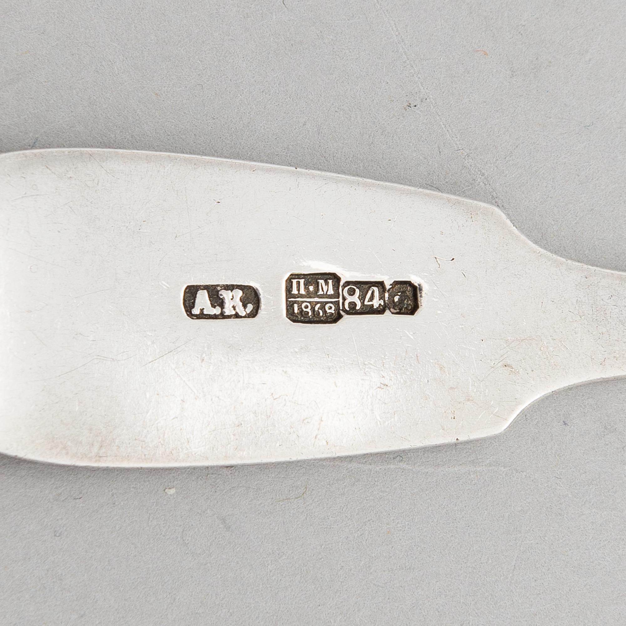 A Russian silver soup ladle and two pairs of silver spoons, Moscow 1874 and Saint Petersburg 1868 and 1887.