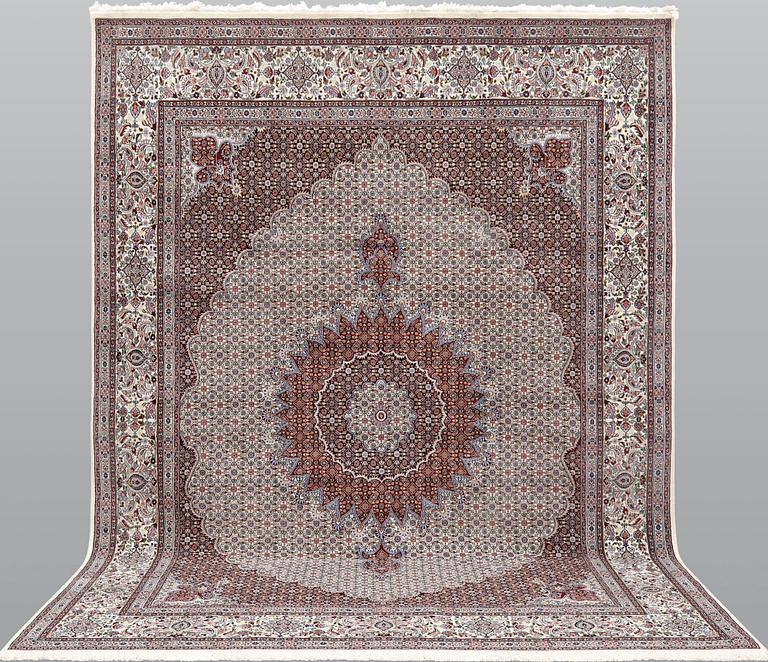 A part silk Moud carpet, approximately 350 x 252 cm.
