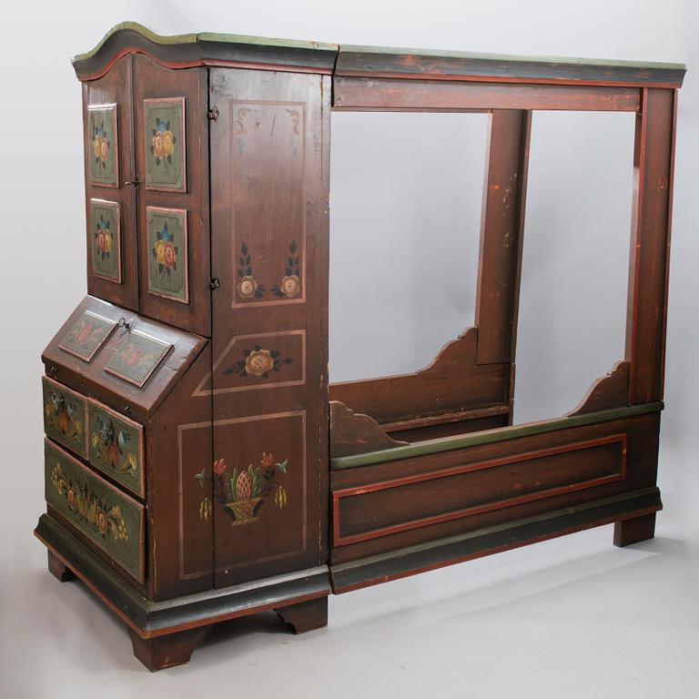 A painted 19th Century folk art bed cabinet.