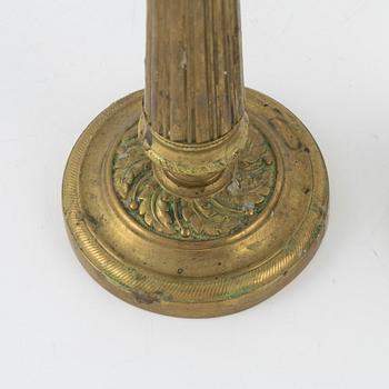 A pair of Empire bronze candlesticks, first half of the 19th Century.