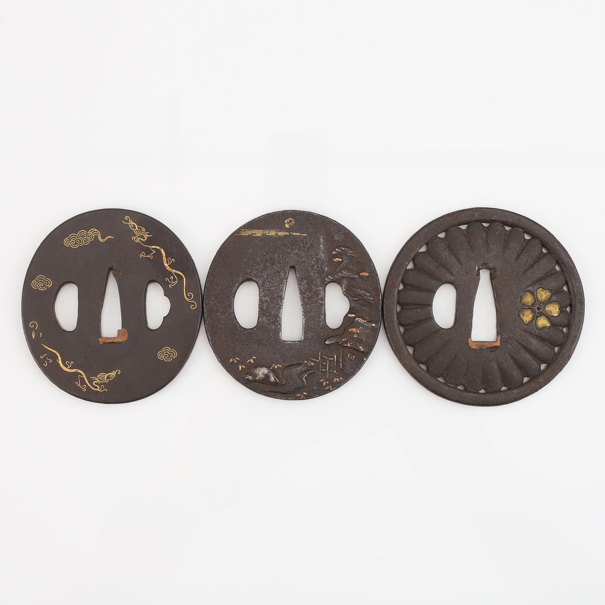 Five iron tsubas, one signed, Edo period.