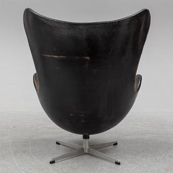 ARNE JACOBSEN, an 'Egg' leather covered easy chair and ottoman, Fritz Hansen, Denmark.