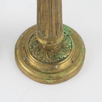 A pair of Empire bronze candlesticks, first half of the 19th Century.