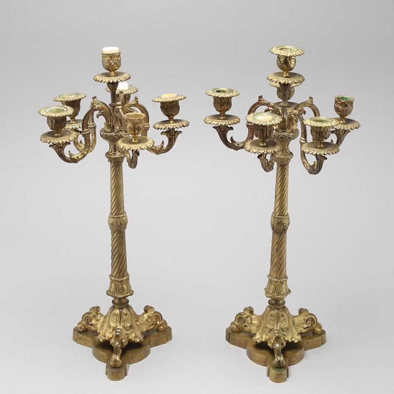 A pair of brass candelabras, 19th century.