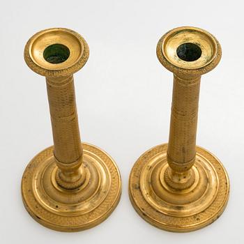 A pair of early 19th century French Empire candlesticks.