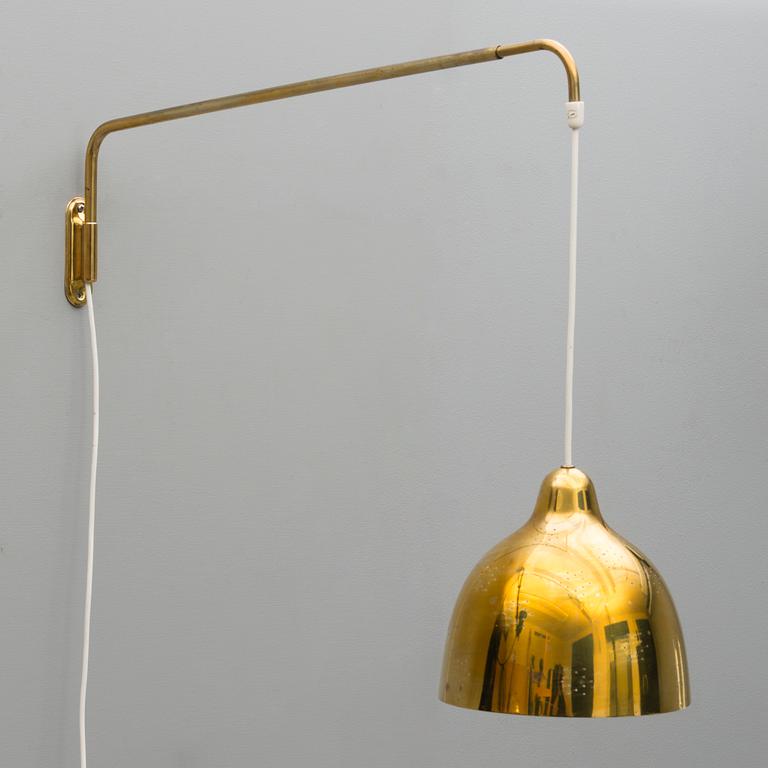 A mid 20th century wall light for Stockmann Orno, Finland.