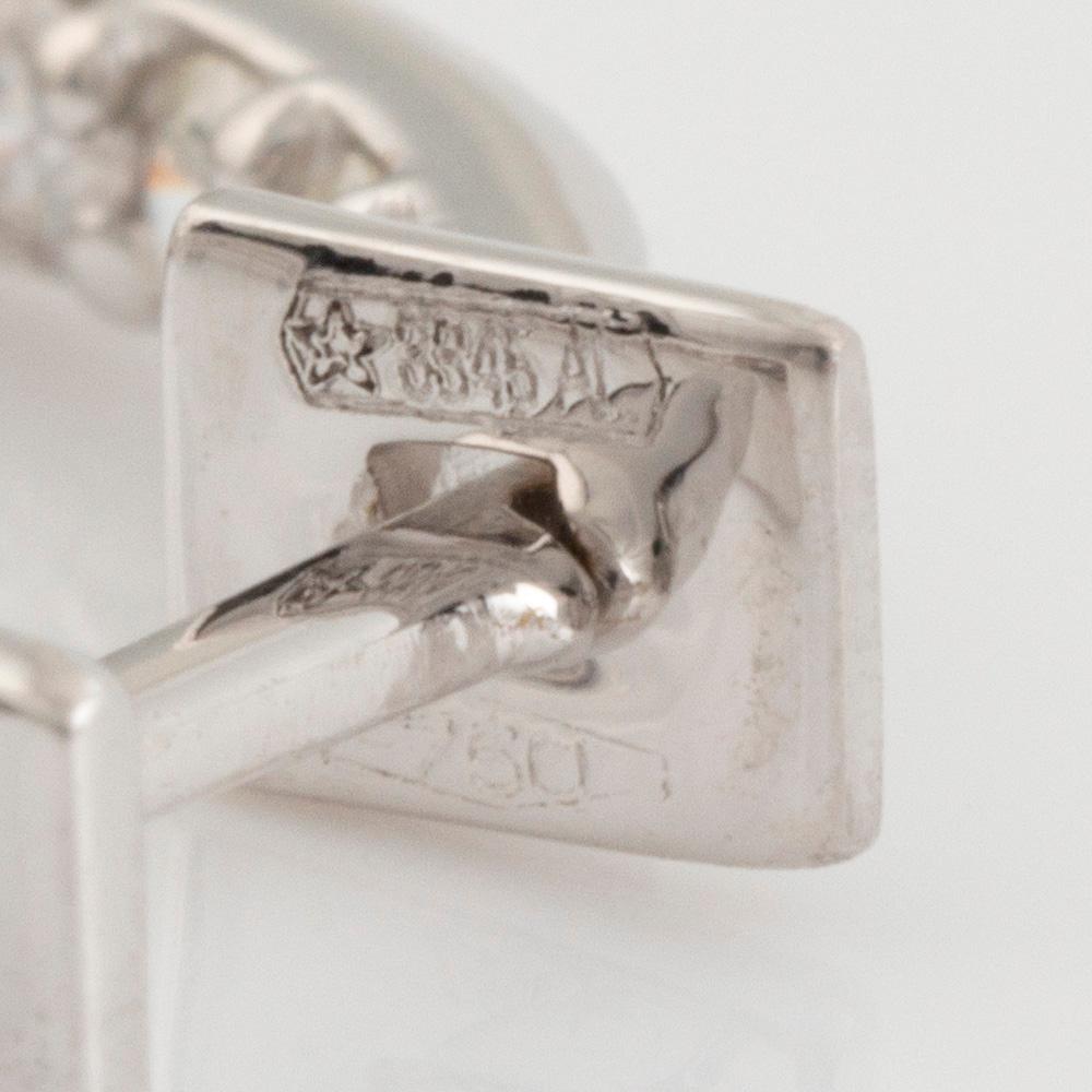 Brilliant cut diamond hoop earrings.