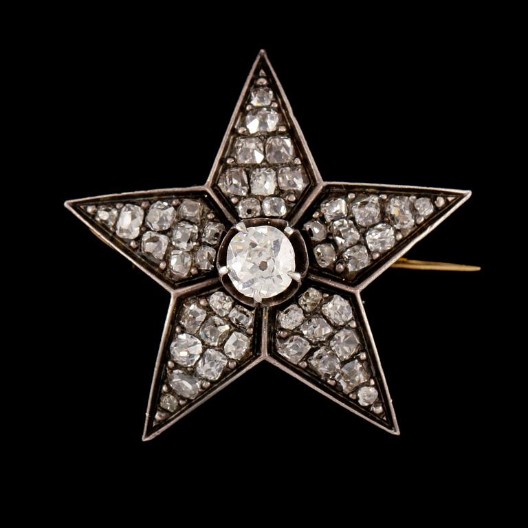 BROSCH, 18k guld och silver med rosenslipade diamanter. Vikt 8 g.