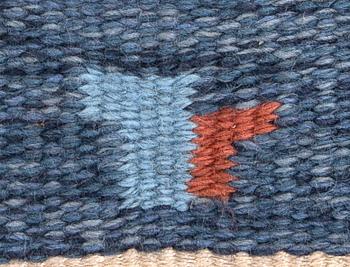 A Swedish flat weave carpet signed Erik Lundberg 245x168 cm.