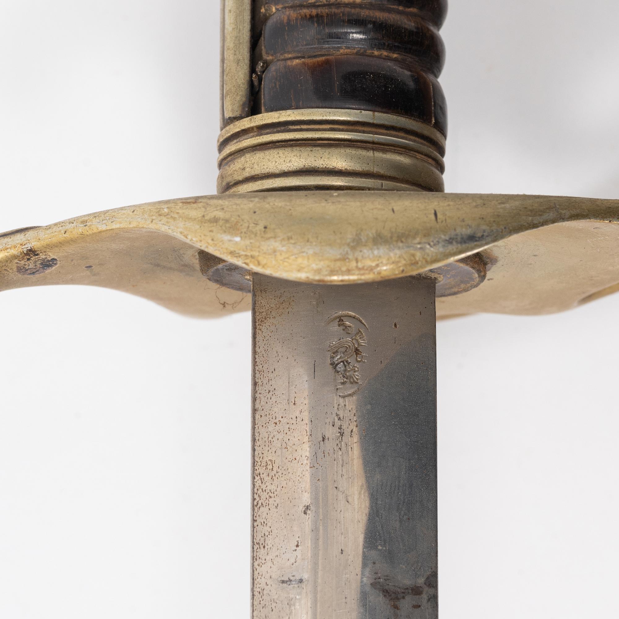A 19th Century sabre with scabbard.
