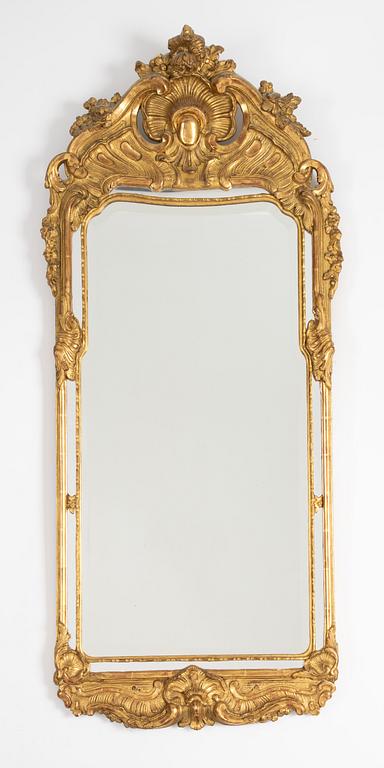 A Rococo style mirror and a console table, first half of the 20th Century.