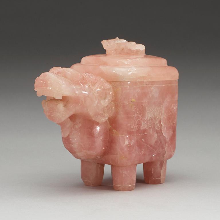 A dragon-shaped rose quartz box with cover, China.