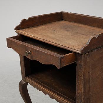 A mid 18th Century oak rococo bedside table.