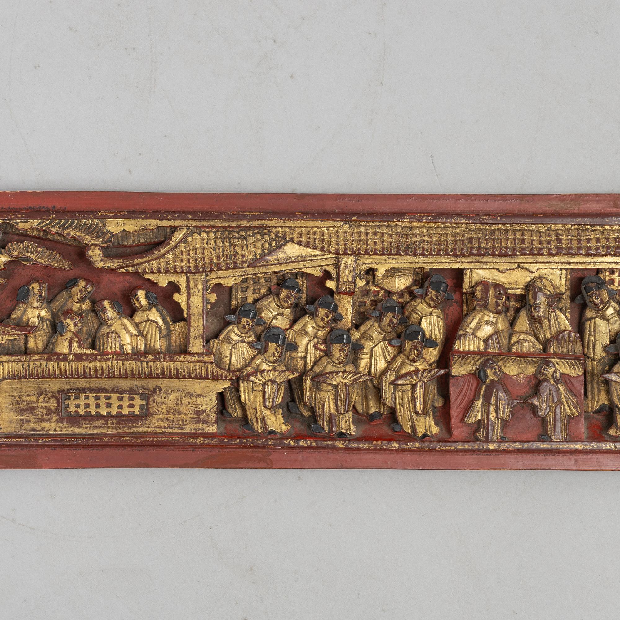 A group of three Chinese wooden panels, late Qing dynasty / around 1900.