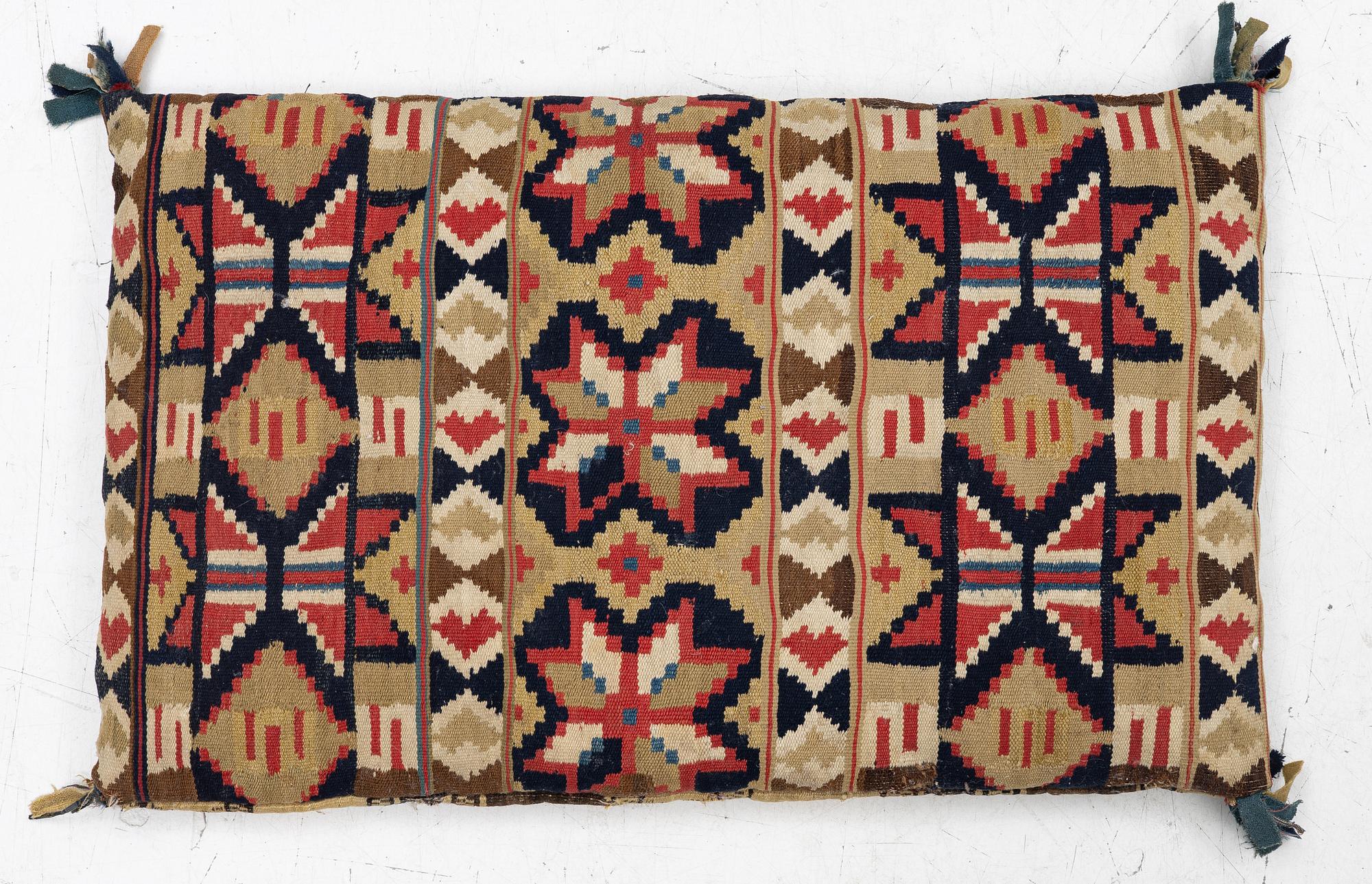 A mid-19th century carrige cushion, flat weave, c. 80 x 46 cm southwest Scania.