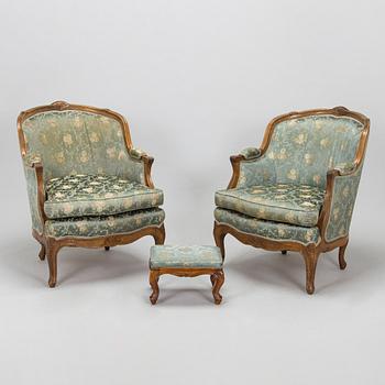 a pair, mid-20th century armchairs and a stool.