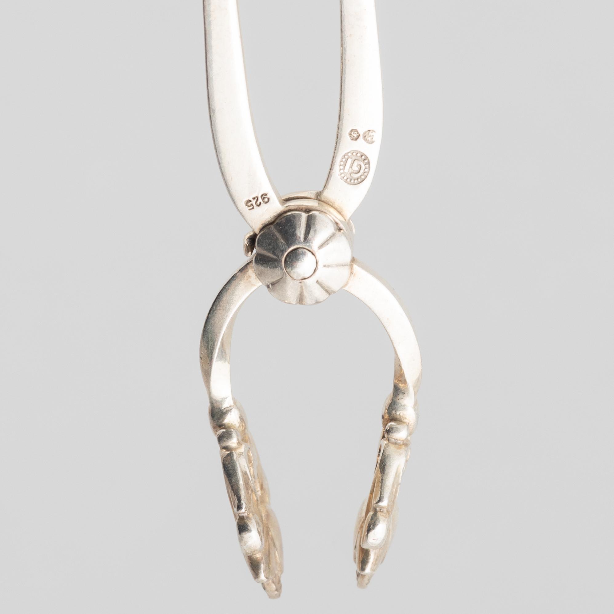 Sugar box, silver 830, Swedish import mark, and sugar tongs, sterling silver, Georg Jensen, Denmark.