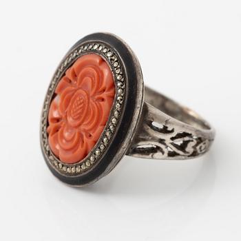 Silver ring with coral and marcasites and with black details.