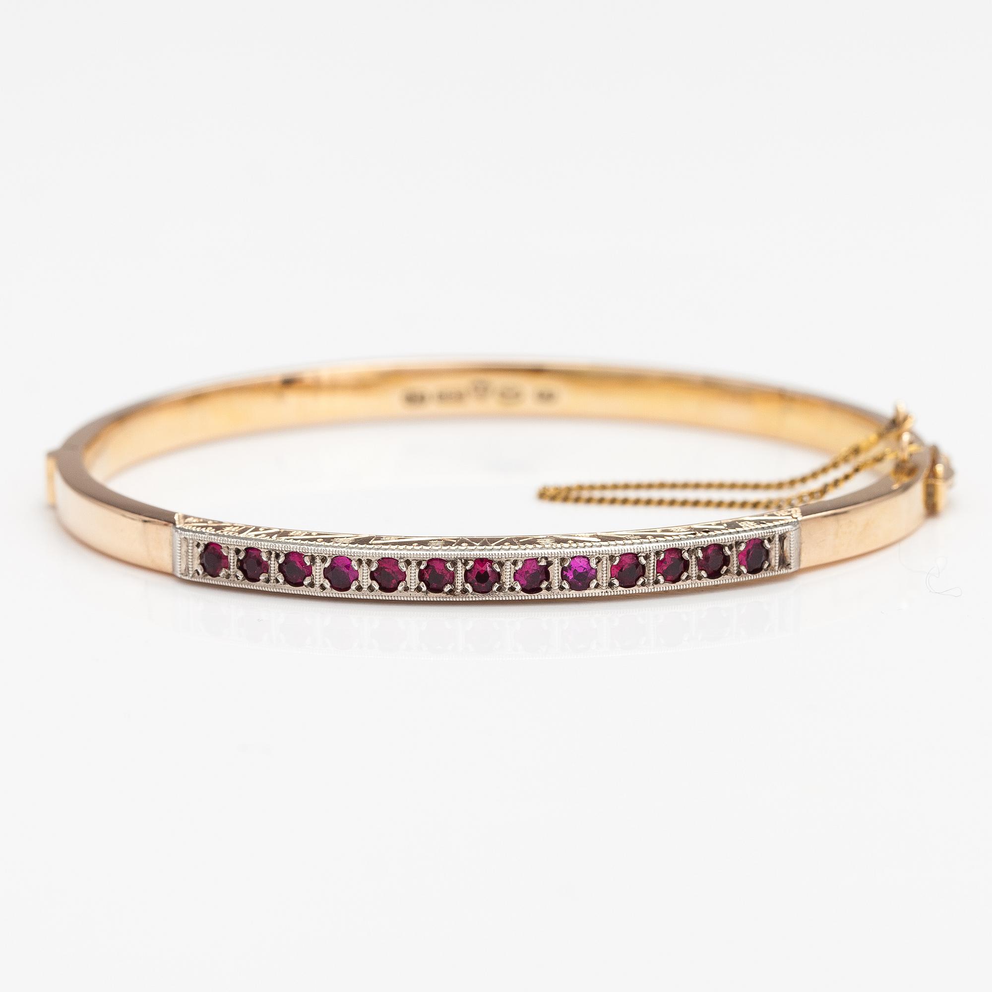 Armband, 14K guld, syntetiska rubiner. Tarkkanen Oy, Helsingfors 1959.