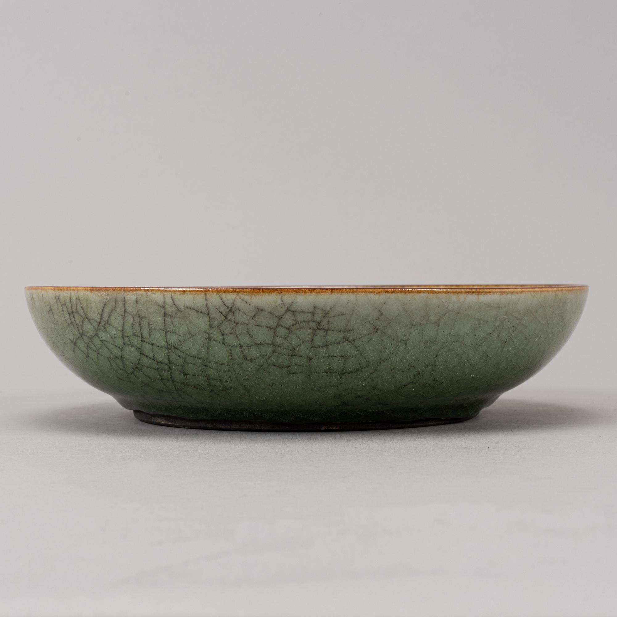 A sang de boef glazed bowl and a ge glazed dish, China, second half of the 20th Century.