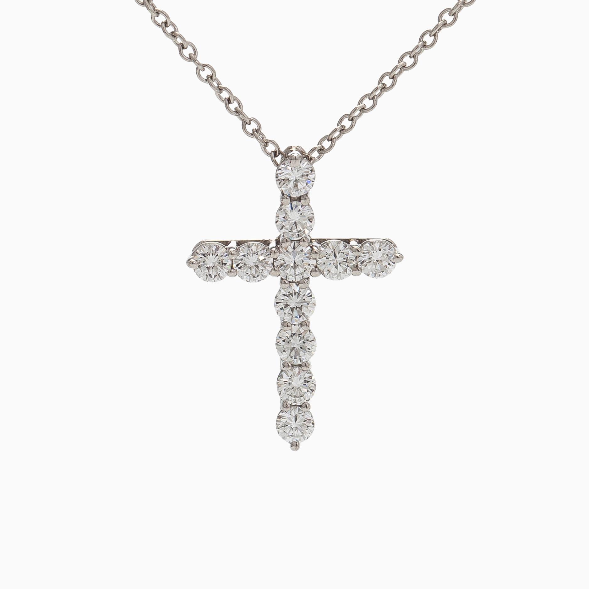 Tiffany & Co, a platinum cross pendant necklace with brilliant-cut diamonds.