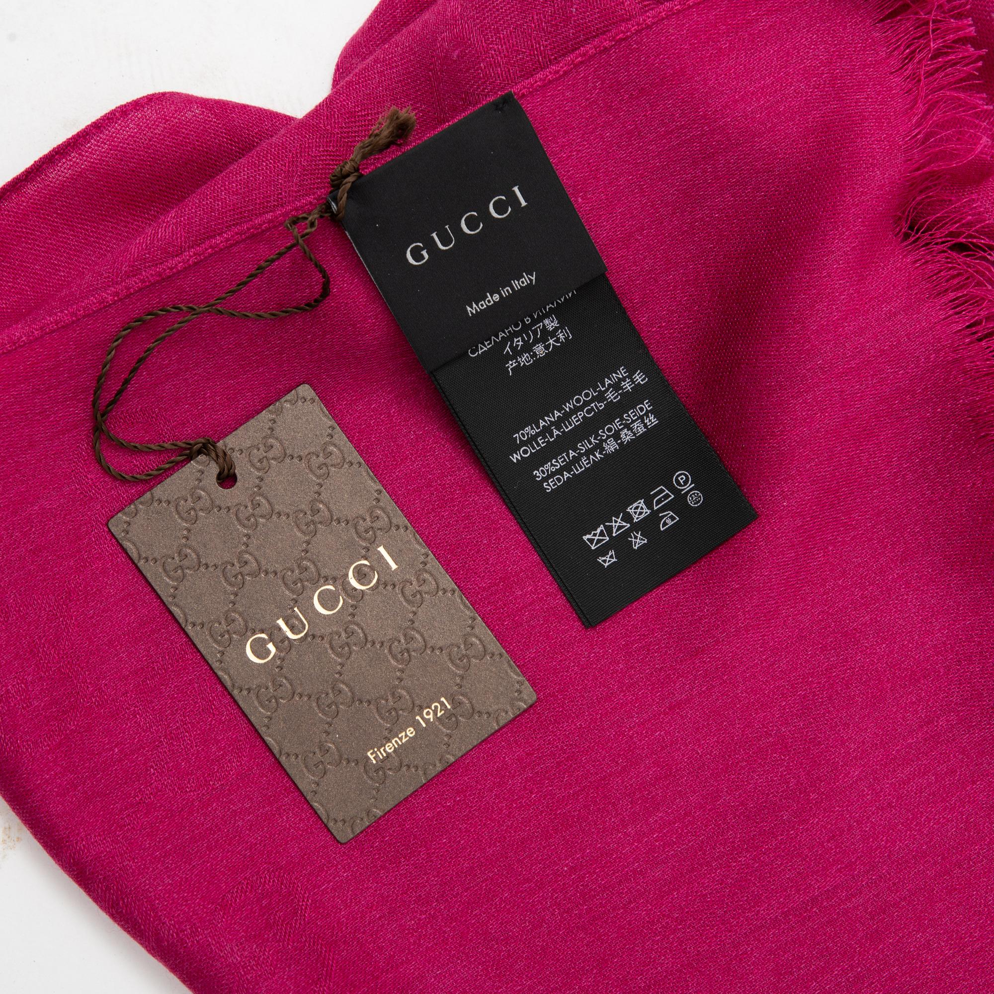 Gucci, a wool and silk mix 'GG' jaquard shawl.