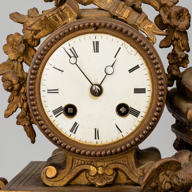 A  French 19th century mantle clock in Louis-XVI style.