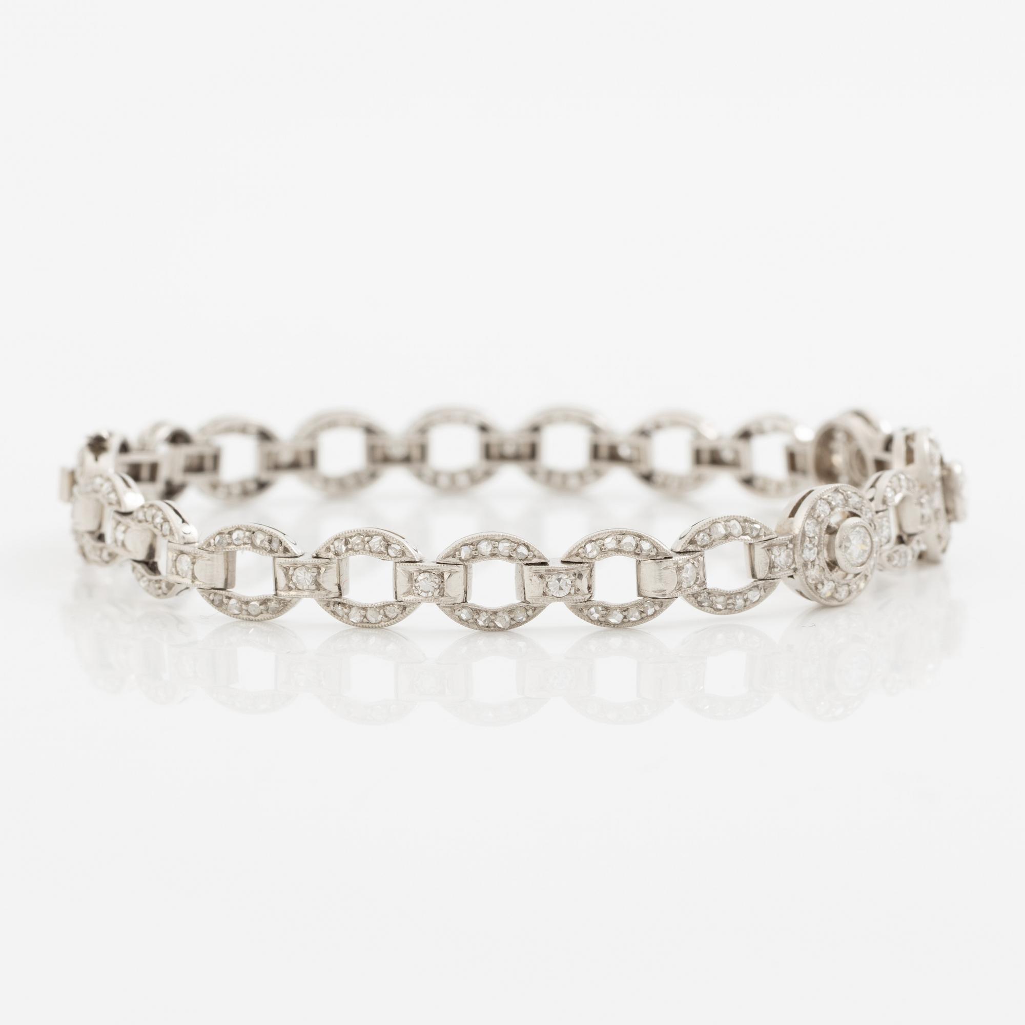 Bracelet in platinum set with round brilliant, octagonal, and rose-cut diamonds.
