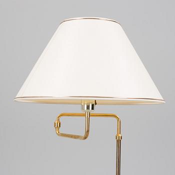 A second half of the 20th century brass wall light and a table light.