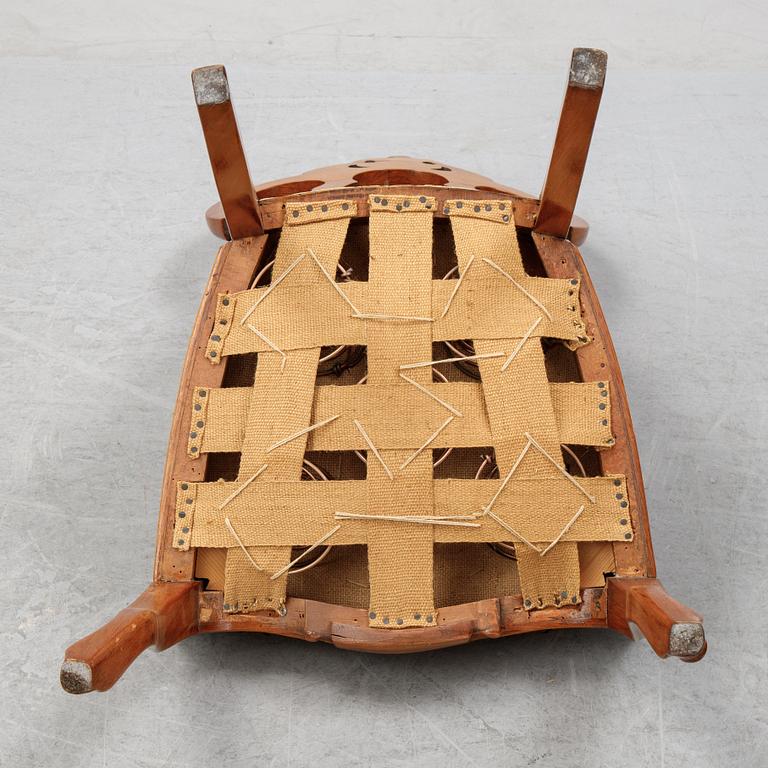 A rococo style sofa, four chairs and a table, second half of the 19th Century.