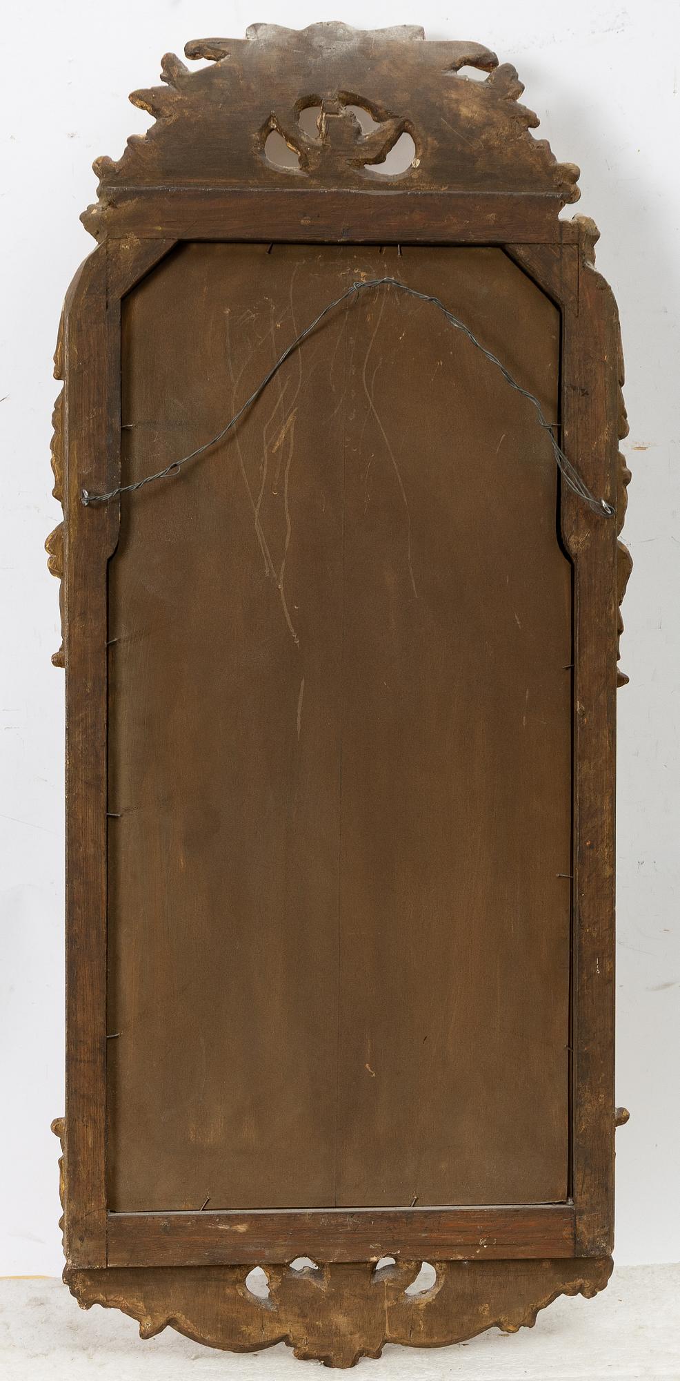 A gilt-gesso rococ-style mirror, 20th century.