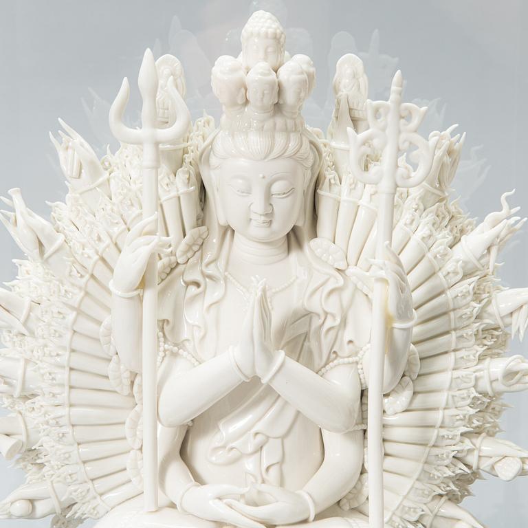 An oriental Buddha statue in porcelain.