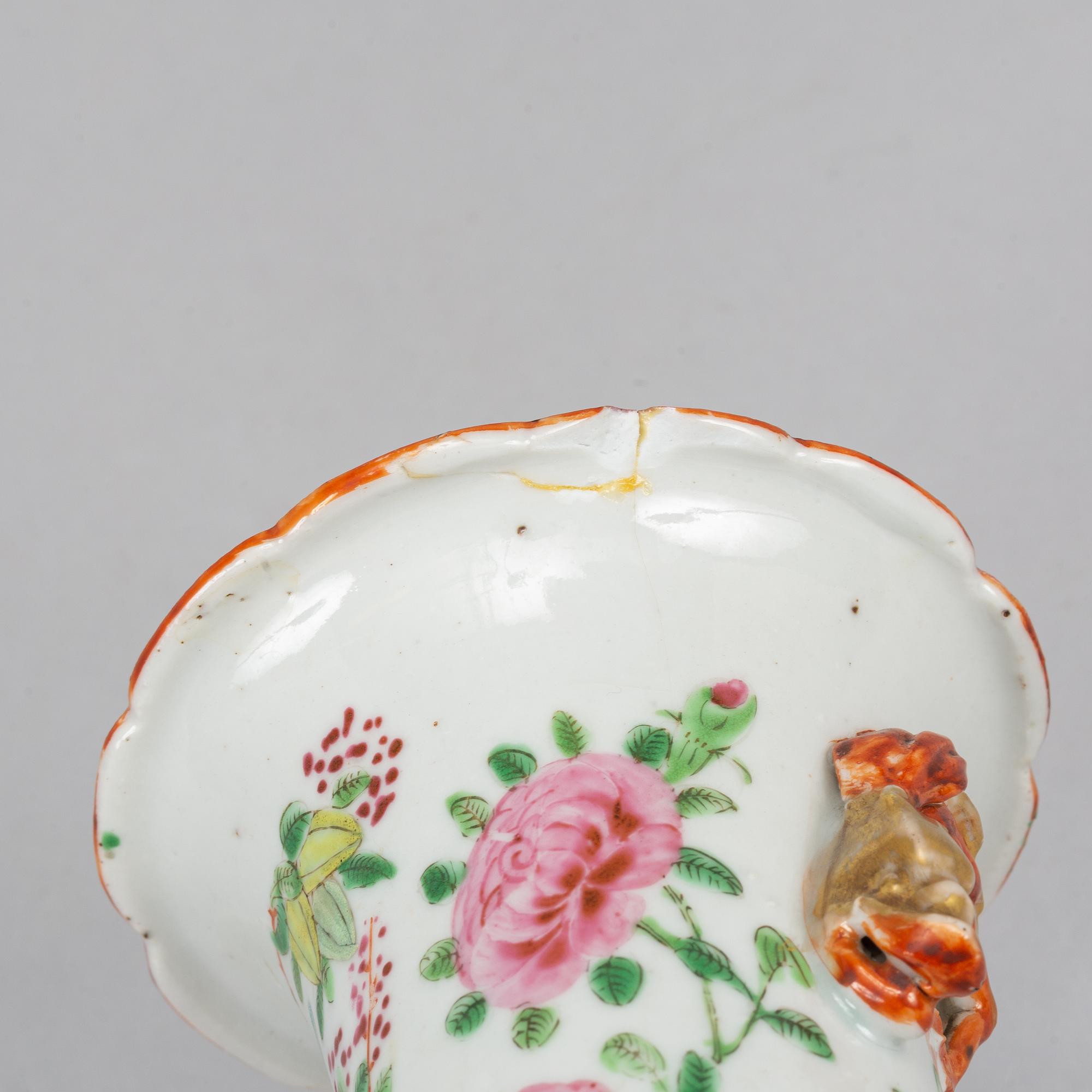 A pair of famille rose Canton table lamps and a vase, Qing dynasty, 19th Century.