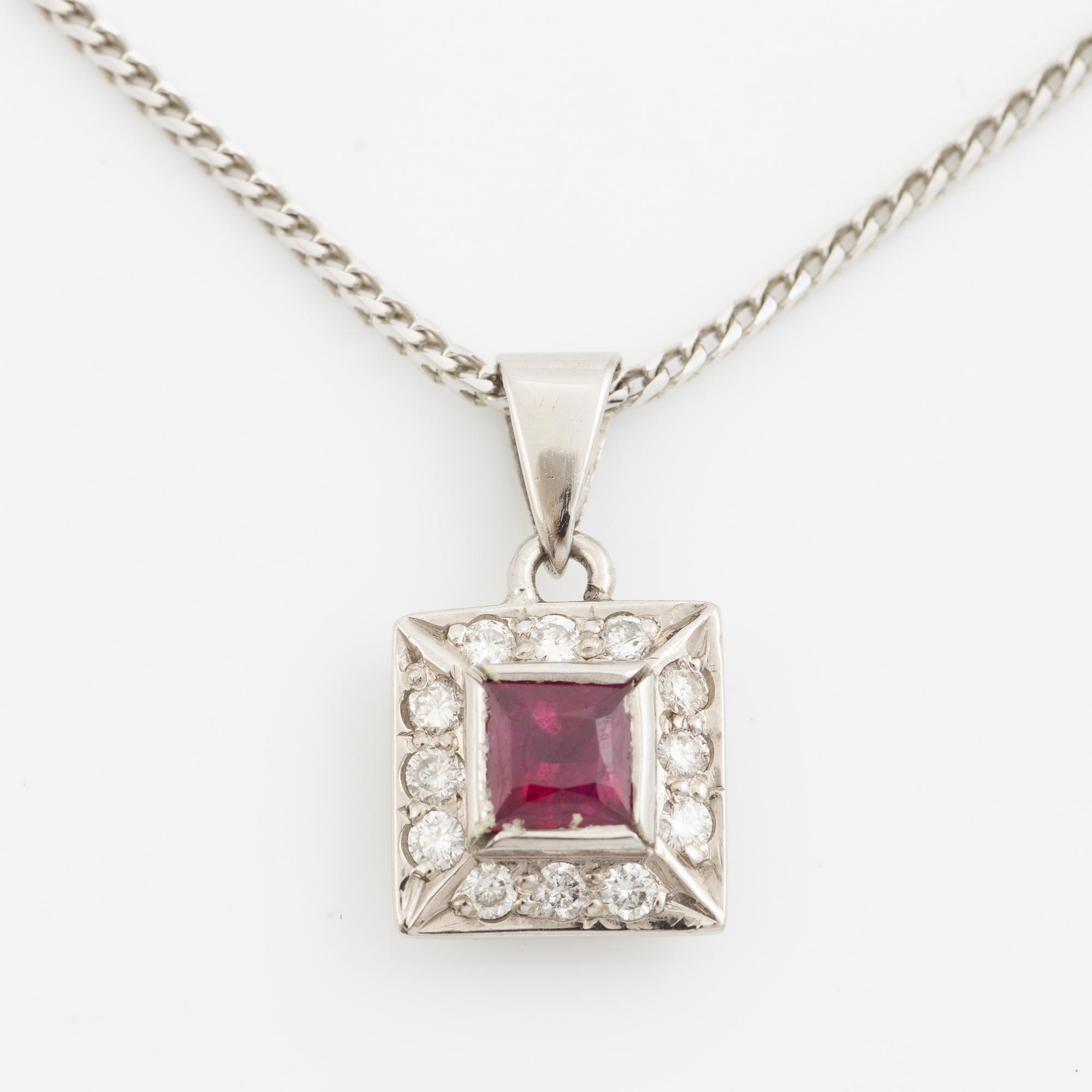 Pendant with chain in 18K white gold featuring a red stone, likely a ruby, and diamonds.