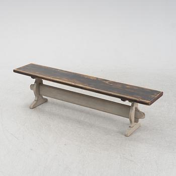 A wooden bench, around 1900.