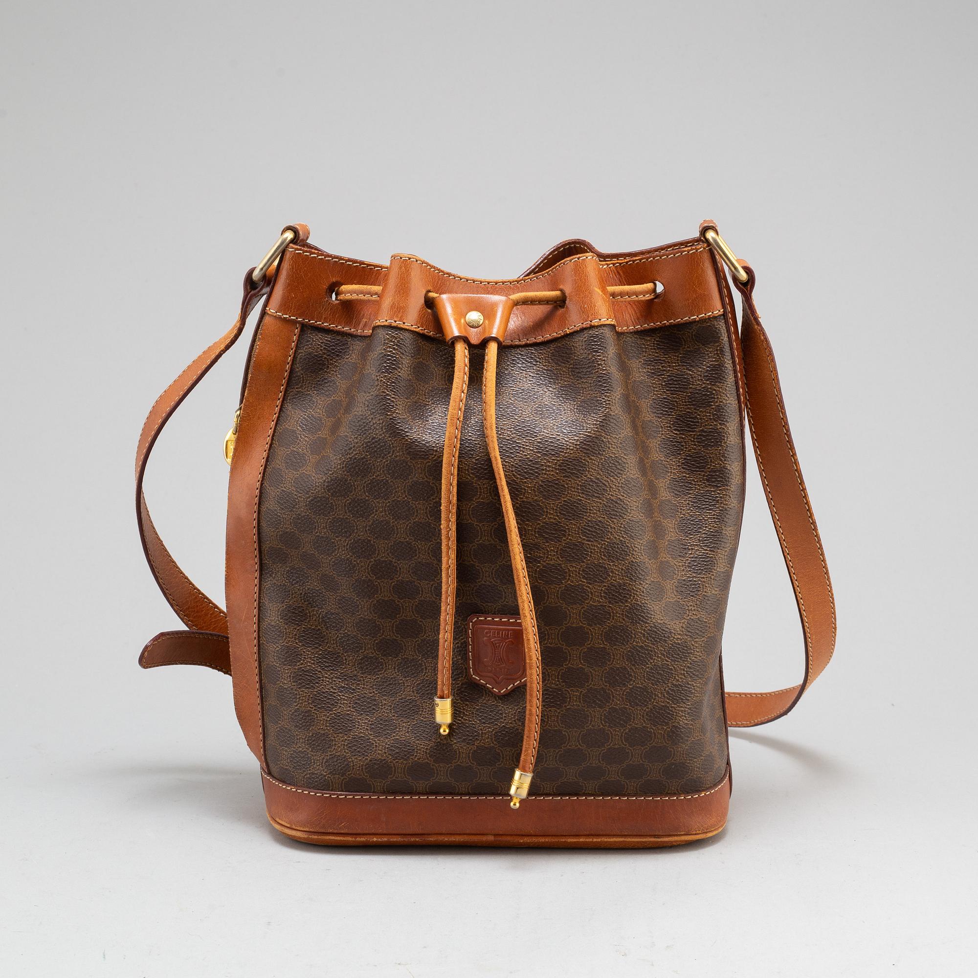 CELINE a monogram canvas bucket bag. Bukowskis